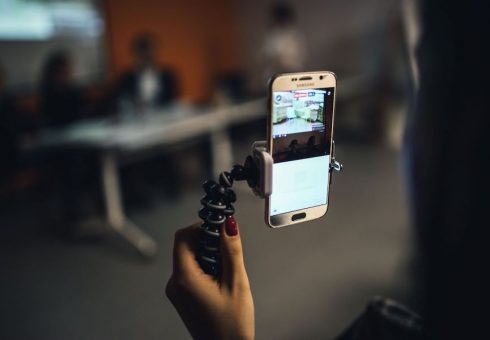 person creating a video with mobile phone
